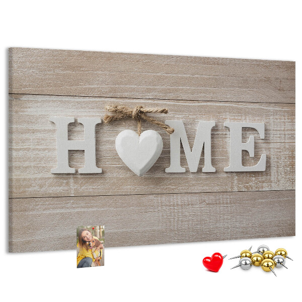 Lavagna di sughero con scritta elegante HOME e decorazione a cuore