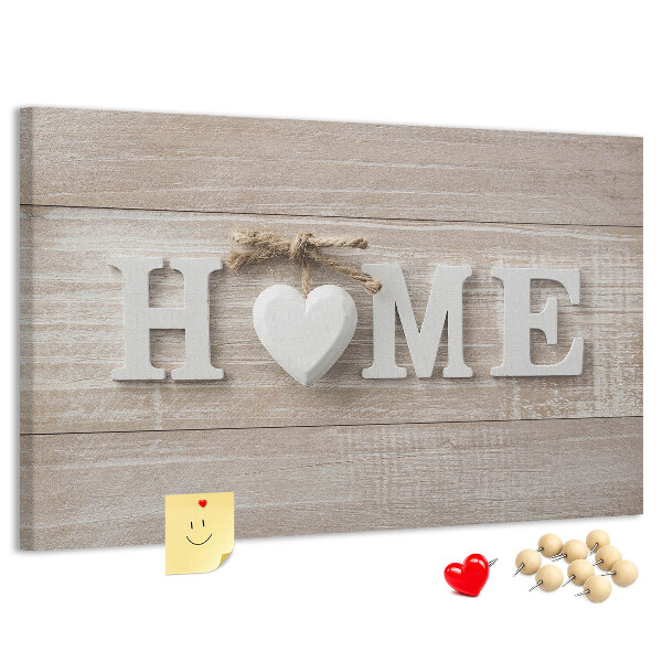 Lavagna di sughero con scritta elegante HOME e decorazione a cuore