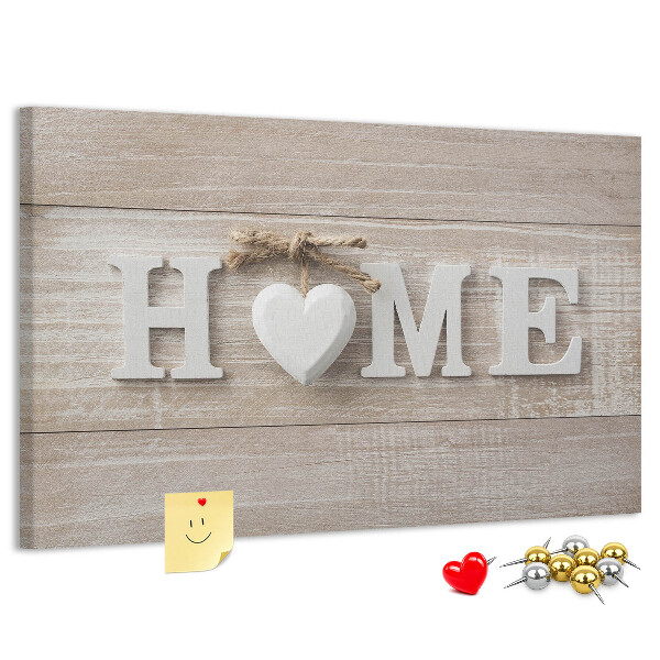 Lavagna di sughero con scritta elegante HOME e decorazione a cuore