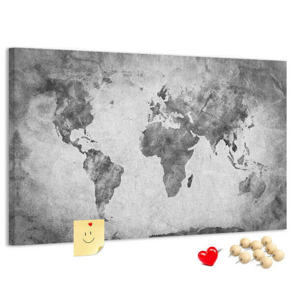Lavagna di sughero con vecchia mappa del mondo nei toni del grigio