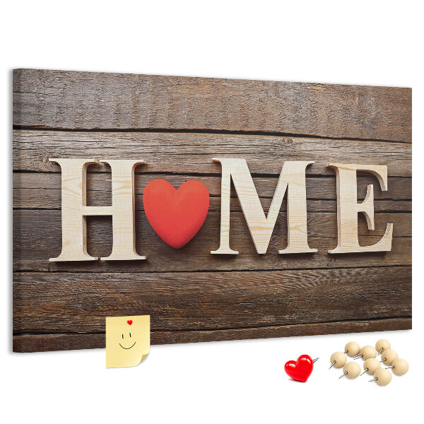 Bacheca in sughero con lettere in legno e cuore sullo sfondo