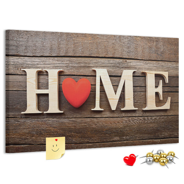 Bacheca in sughero con lettere in legno e cuore sullo sfondo