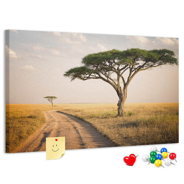 Bacheca in sughero con stampa di una strada attraverso un paesaggio africano con un albero