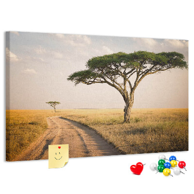 Bacheca in sughero con stampa di una strada attraverso un paesaggio africano con un albero