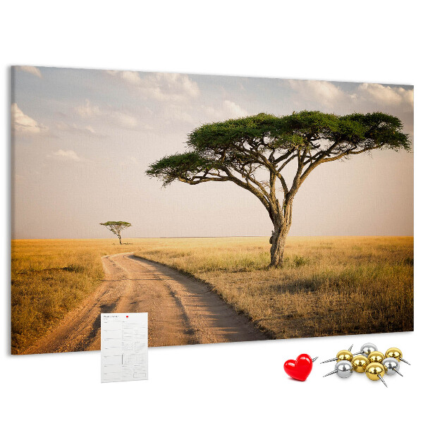 Bacheca in sughero con stampa di una strada attraverso un paesaggio africano con un albero