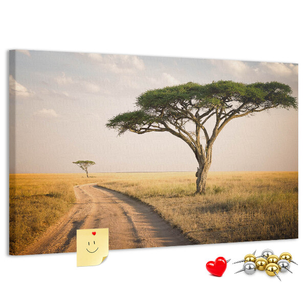 Bacheca in sughero con stampa di una strada attraverso un paesaggio africano con un albero
