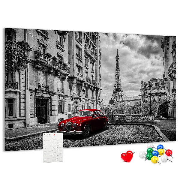 Bacheca in sughero con illustrazione di un'auto rossa a Parigi