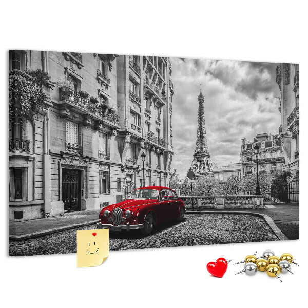 Bacheca in sughero con illustrazione di un'auto rossa a Parigi